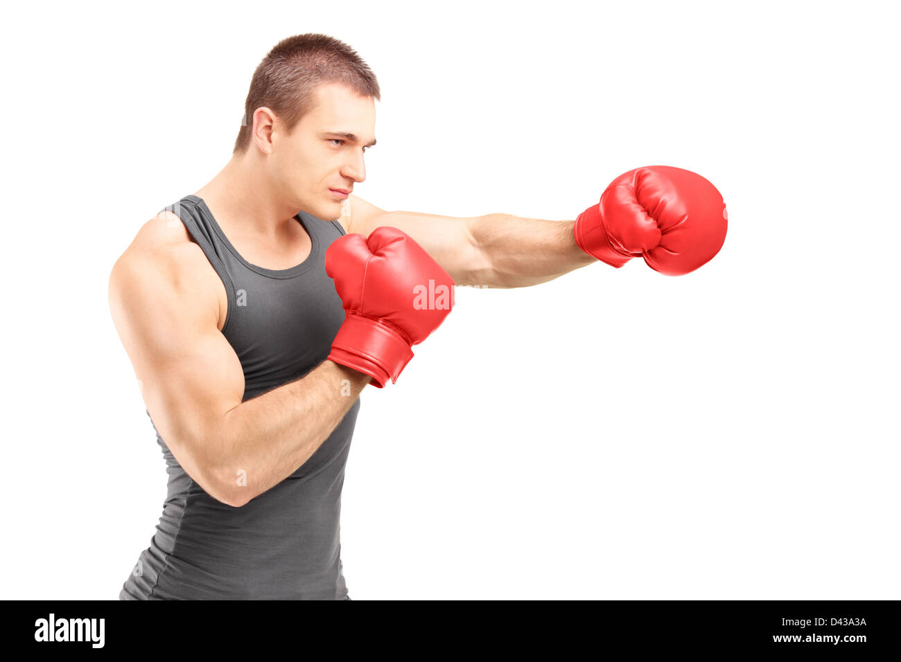 Male boxer punching with red boxing gloves isolated on white background