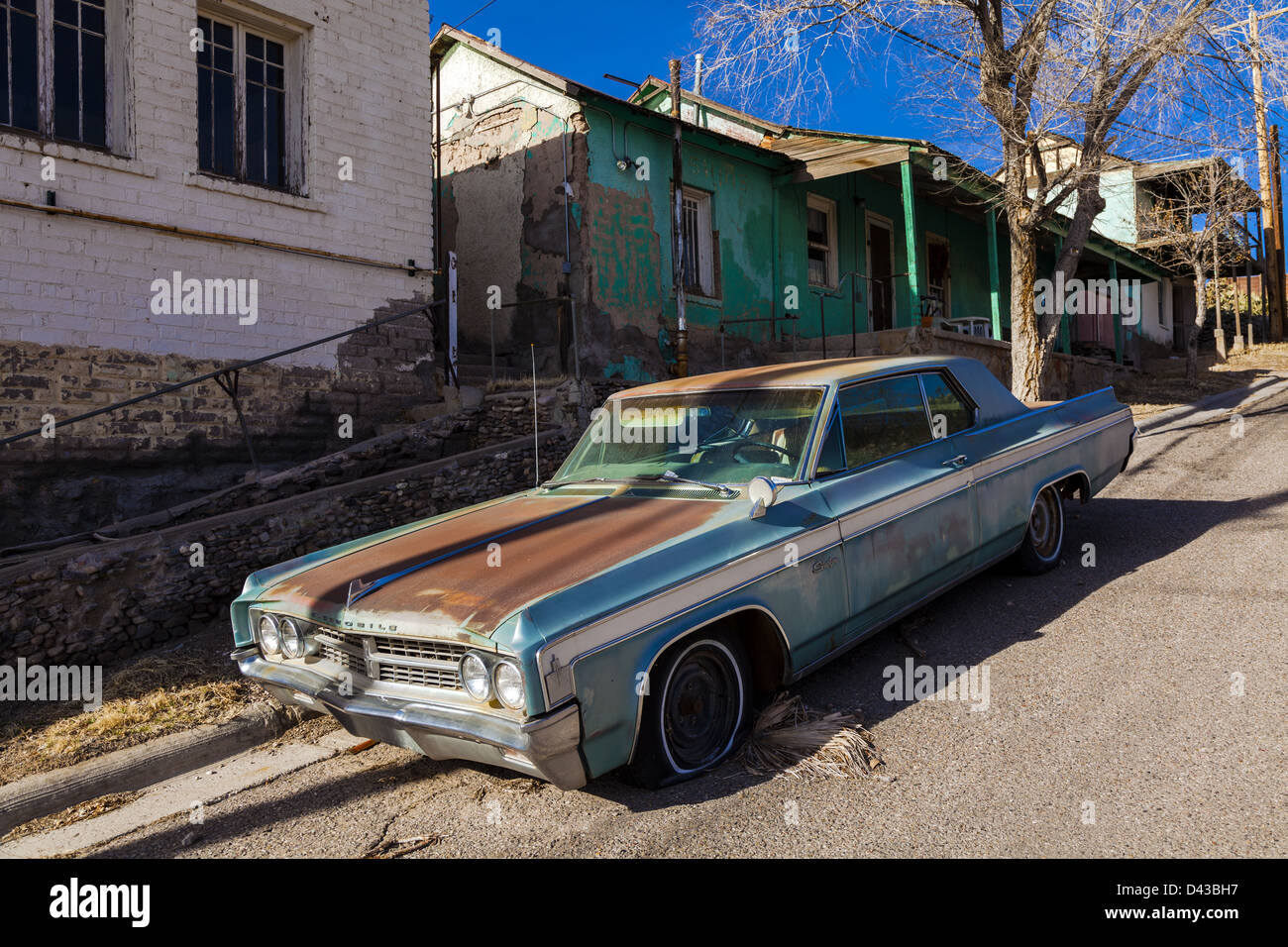 Rusty derelict Oldsmobile Starfire in a side street in Truth or Consequences, New Mexico, USA Stock Photo