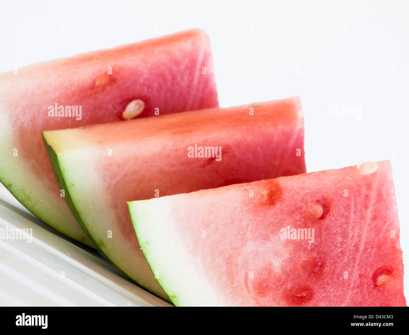 Fresh slices of watermelon on white background Stock Photo - Alamy