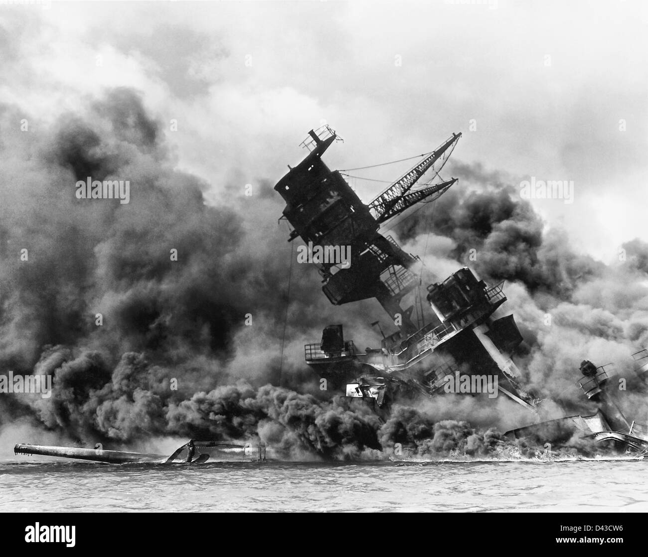 US Navy battleship the USS Arizona burning after the Japanese attack on Pearl Harbor December 7, 1941 in Pearl Harbor, Hawaii. Stock Photo