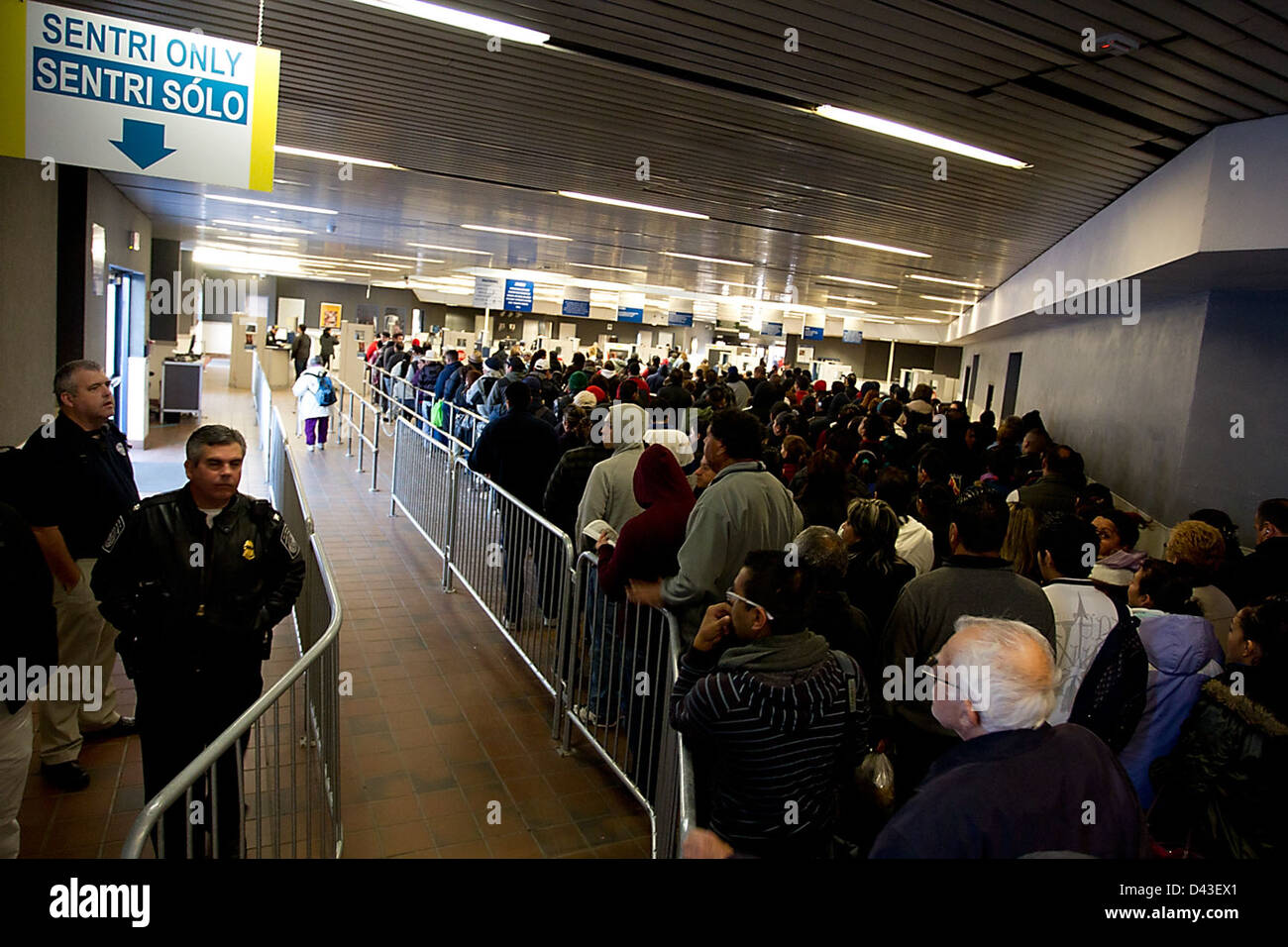 This image shows U.S. Customs and Border Protection officers and ...