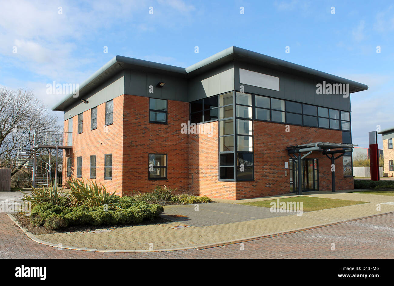 Modern office building available for rent in business park. Stock Photo