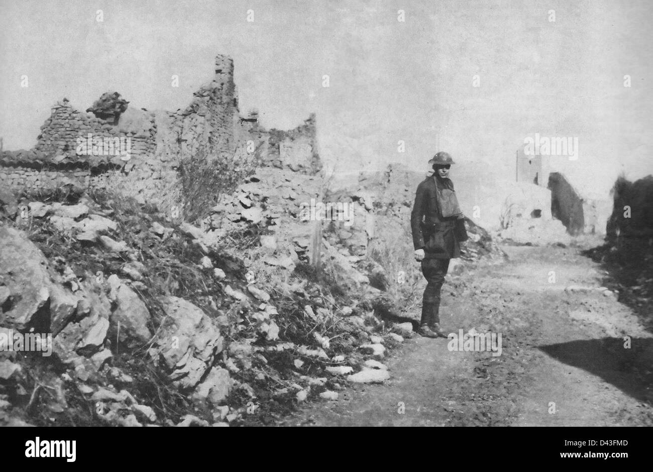 American soldier standing next to ruins in France during World War I, 1917 Stock Photo