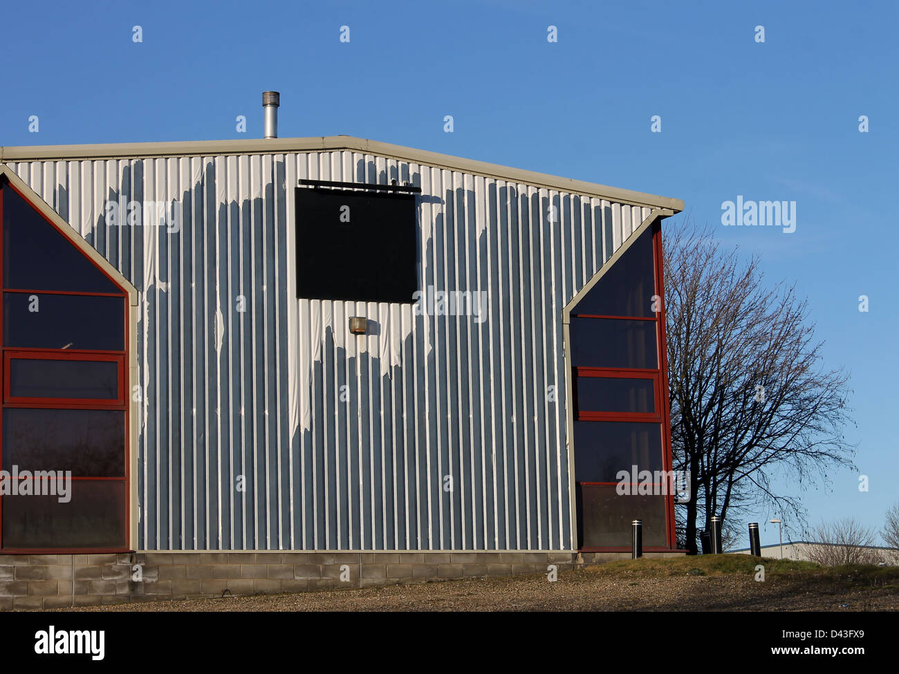 Exterior of old industrial building with blank sign. Stock Photo