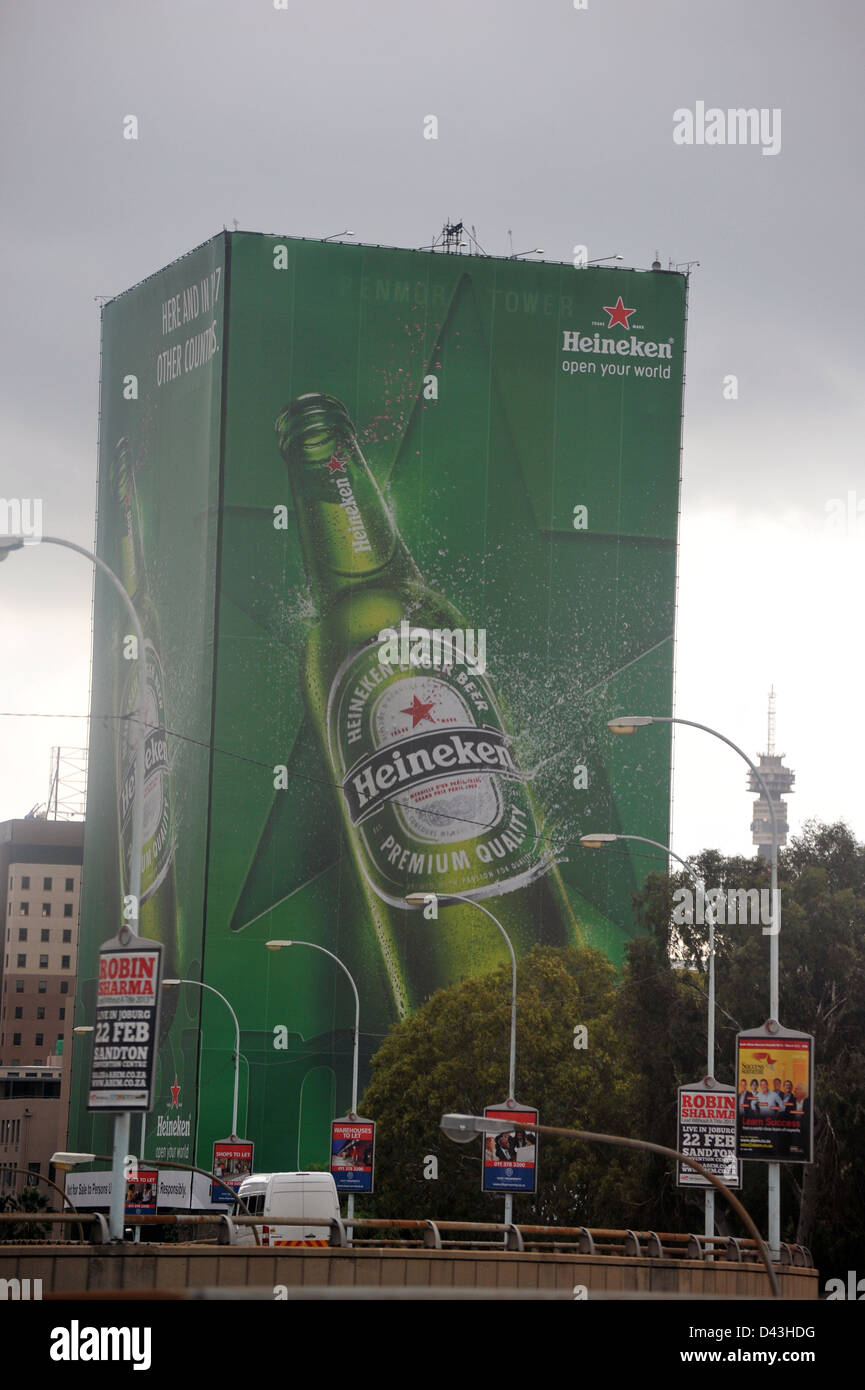 A massive Heineken advert on the side of a skyscraper in Johannesburg. Stock Photo