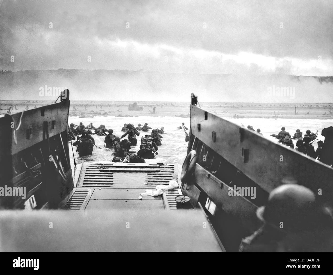 A US Coast Guard Landing Craft from the USS Samuel Chase disembarks troops of the US Army First Division on the morning the D-Day invasion June 6, 1944 at Omaha Beach, Normandy, France. Stock Photo