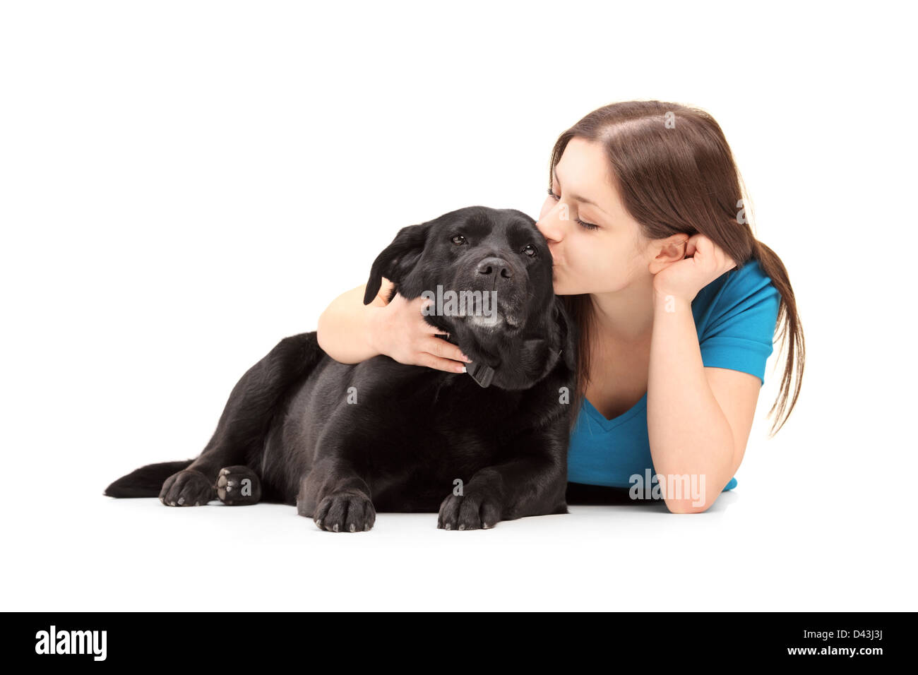 Young female hugging and kissing her dog isolated on white background Stock Photo