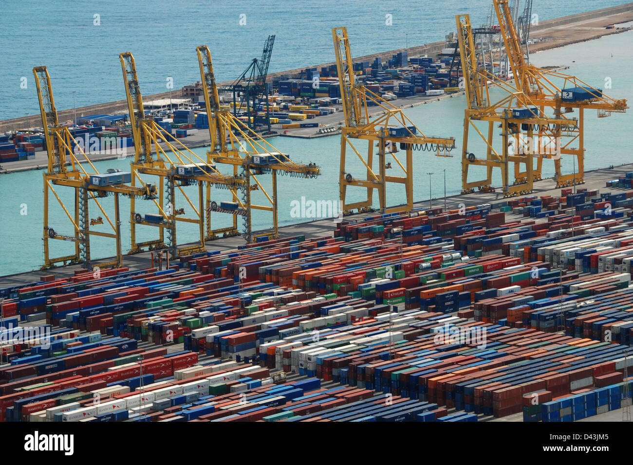 Cranes and cargo at Barcelona dockyard Stock Photo - Alamy