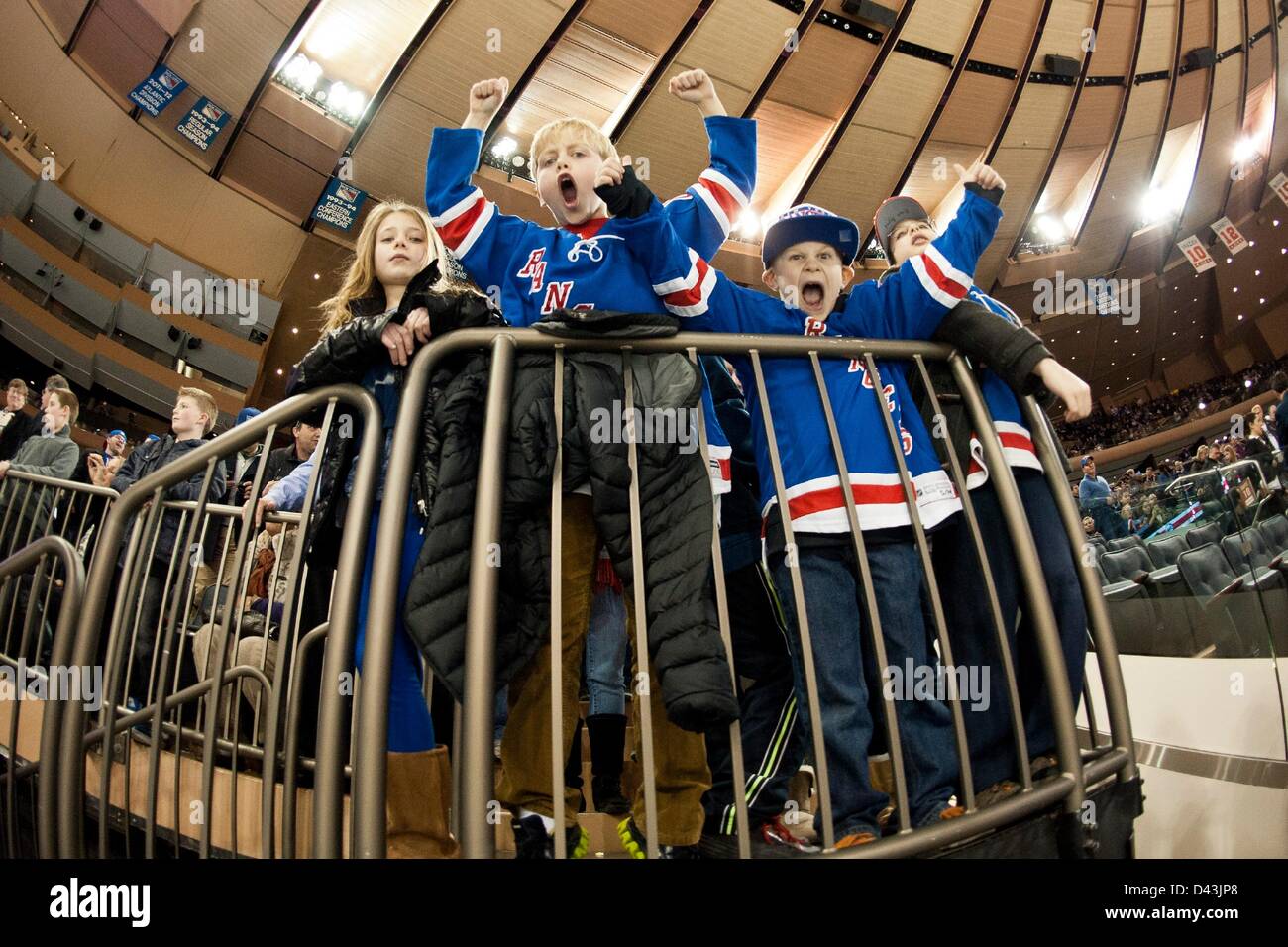 Fans cheer on the New York Rangers as they take the ice to warm
