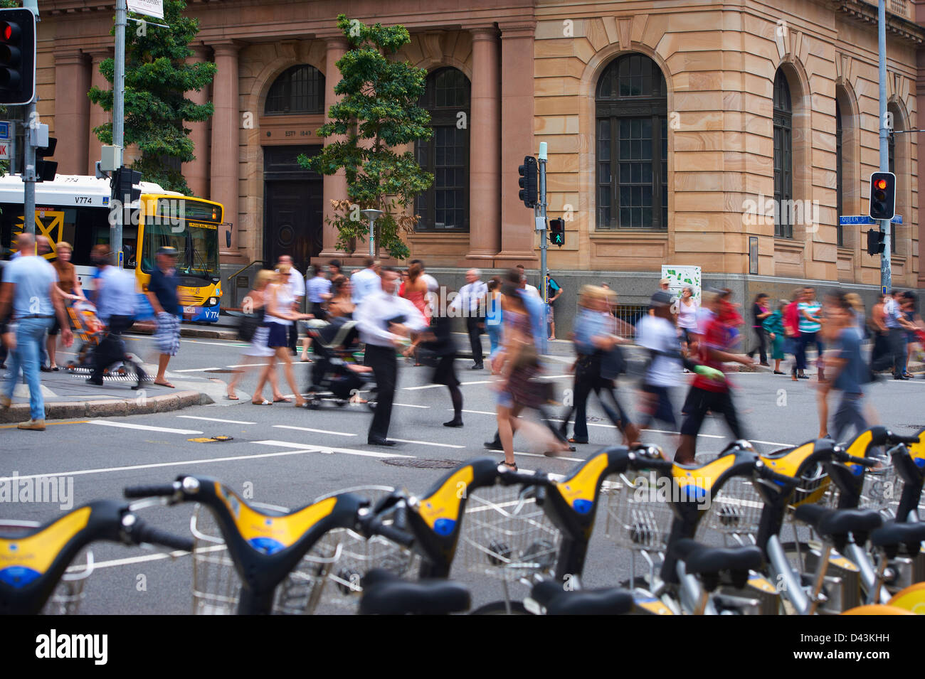 Brisbane City Council Bus in the city and pedestrians Stock Photo