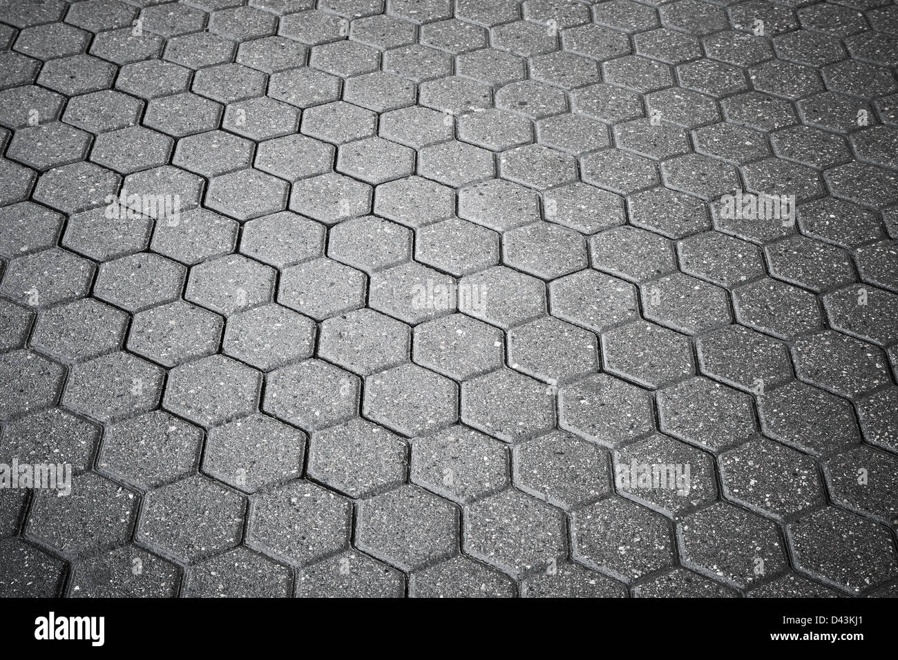 Background texture of gray cellular cobblestone road Stock Photo