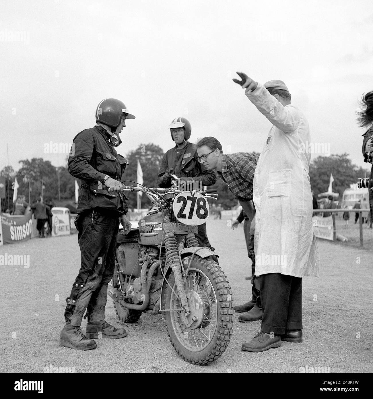 US actor Steve McQueen (L) prepares for a ride during a rest as he took  part in the international motorcycle race "Six Days" on his Triumph with  the number "278" at in