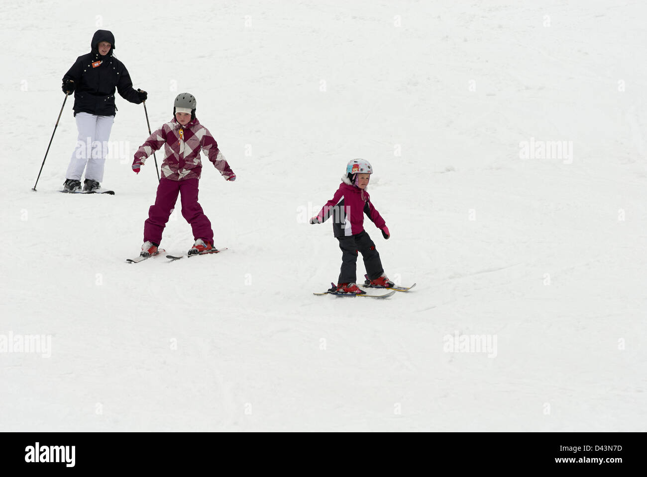 Children practice their form at ski school Stock Photo