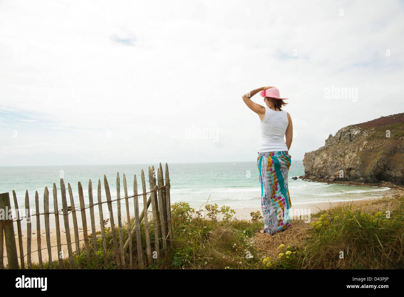 Rear View of Woman on Beach, Camaret-sur-Mer, Crozon Peninsula, Finistere, Brittany, France Stock Photo