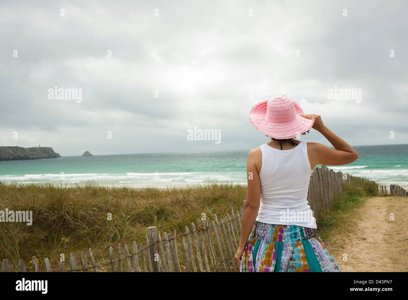 Rear View of Woman on Beach, Camaret-sur-Mer, Crozon Peninsula, Finistere, Brittany, France Stock Photo