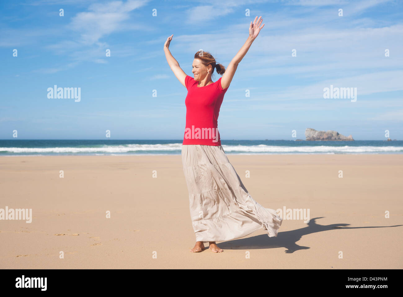 Woman with Arms in the Air at the Beach, Camaret-sur-Mer, Crozon Peninsula, Finistere, Brittany, France Stock Photo