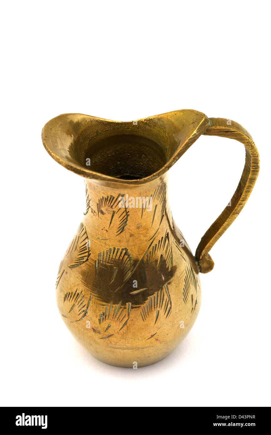 Vintage brass miniature jug on white background Stock Photo