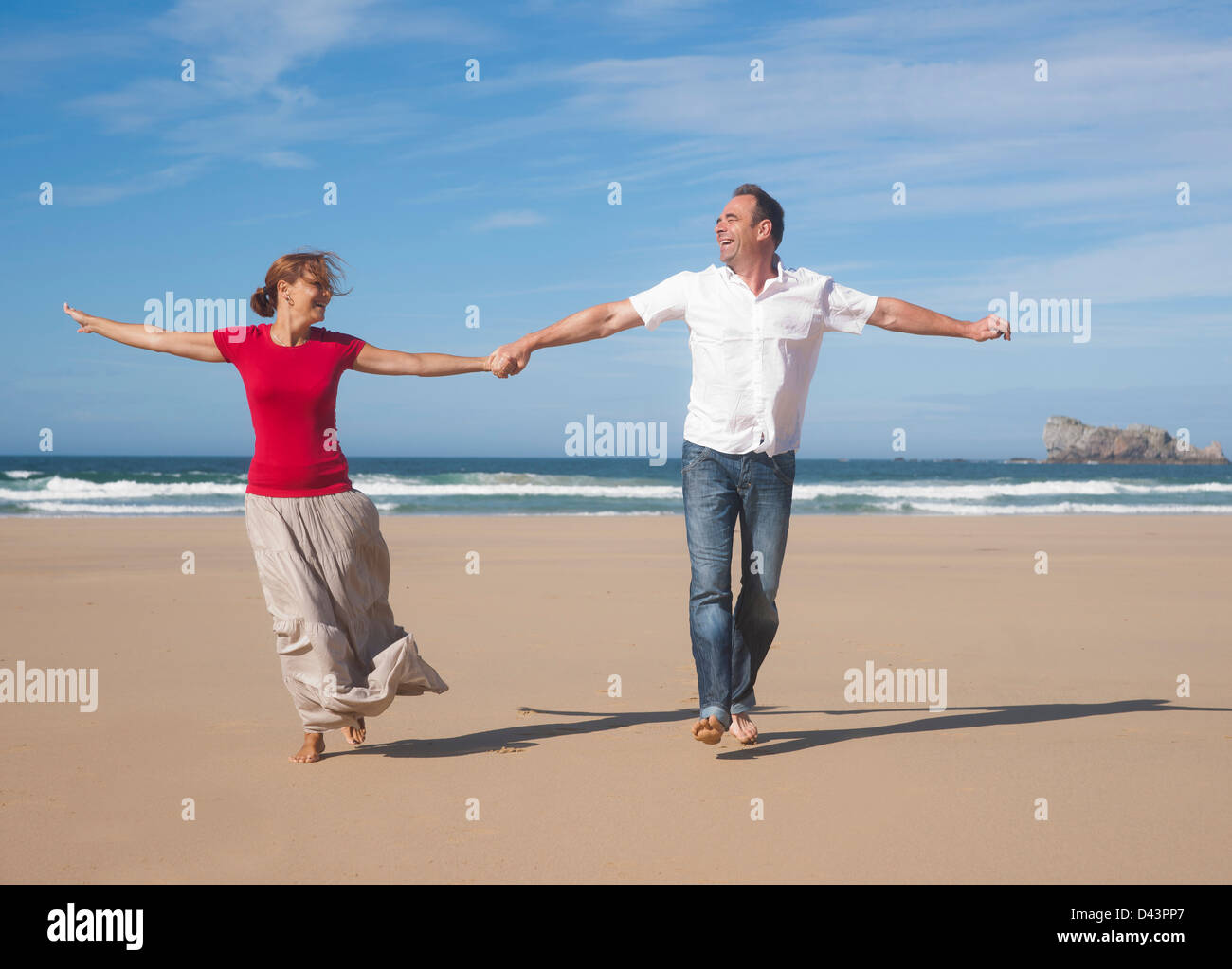 Couple Holding Hands and Walking on the Beach, Camaret-sur-Mer, Crozon Peninsula, Finistere, Brittany, France Stock Photo