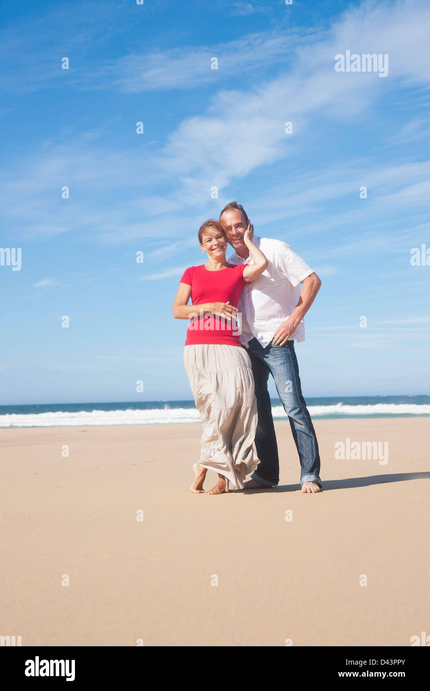 Portrait of Mature Couple Hugging on the Beach, Camaret-sur-Mer, Crozon Peninsula, Finistere, Brittany, France Stock Photo