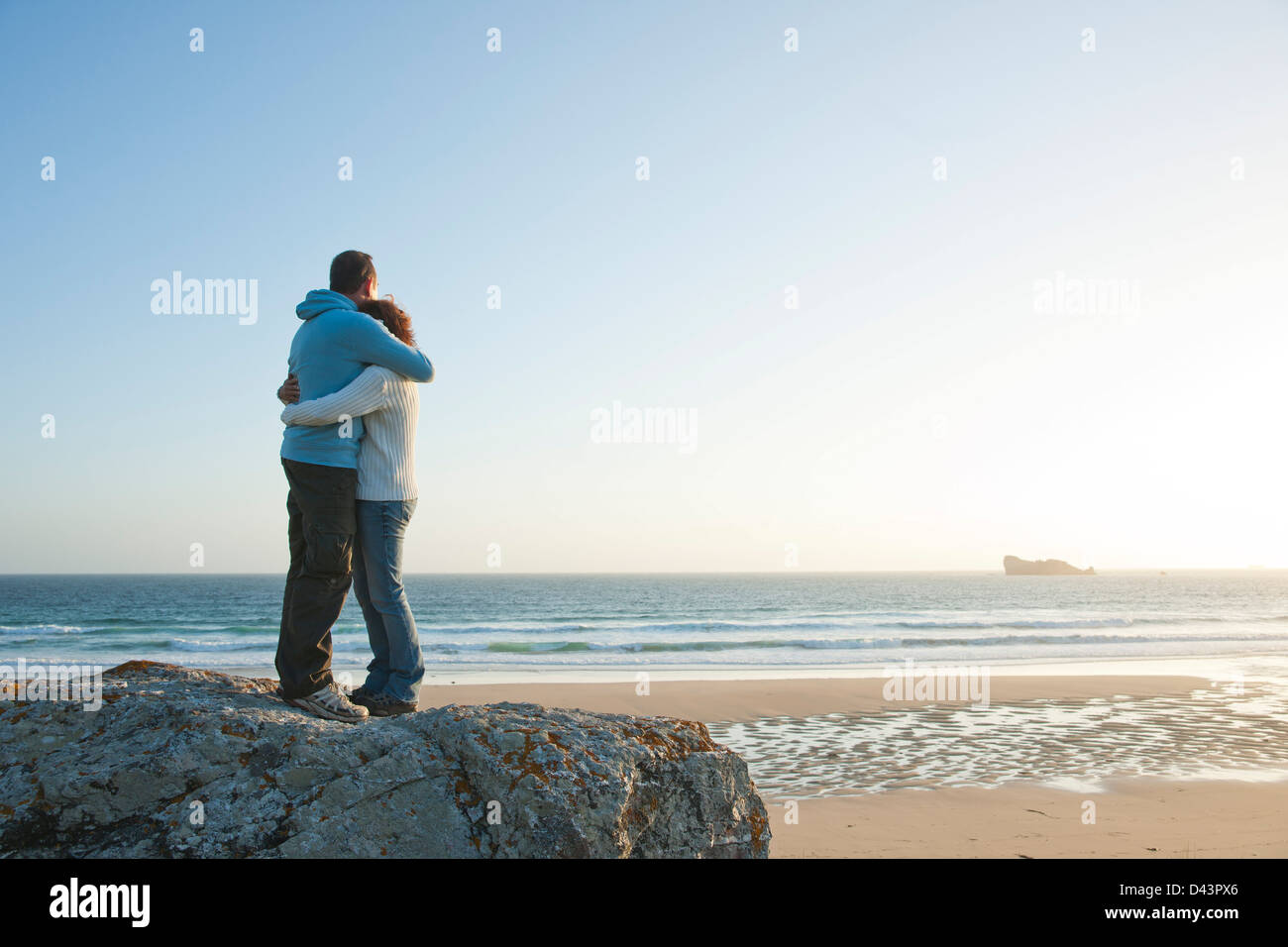 Mature Couple Hugging on the Beach, Camaret-sur-Mer, Crozon Peninsula, Finistere, Brittany, France Stock Photo