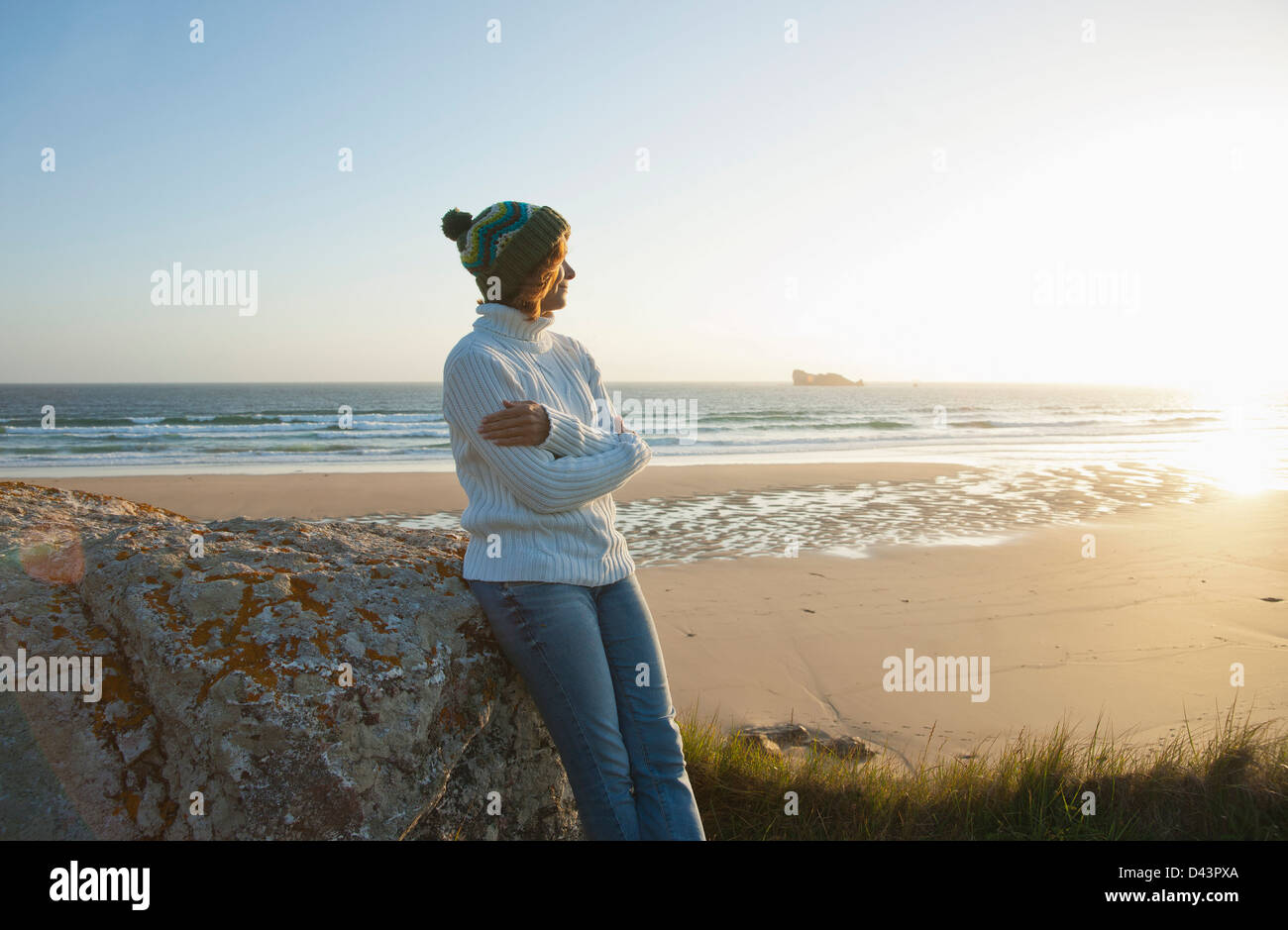 Woman Looking into the Distance at the Beach, Camaret-sur-Mer, Crozon Peninsula, Finistere, Brittany, France Stock Photo