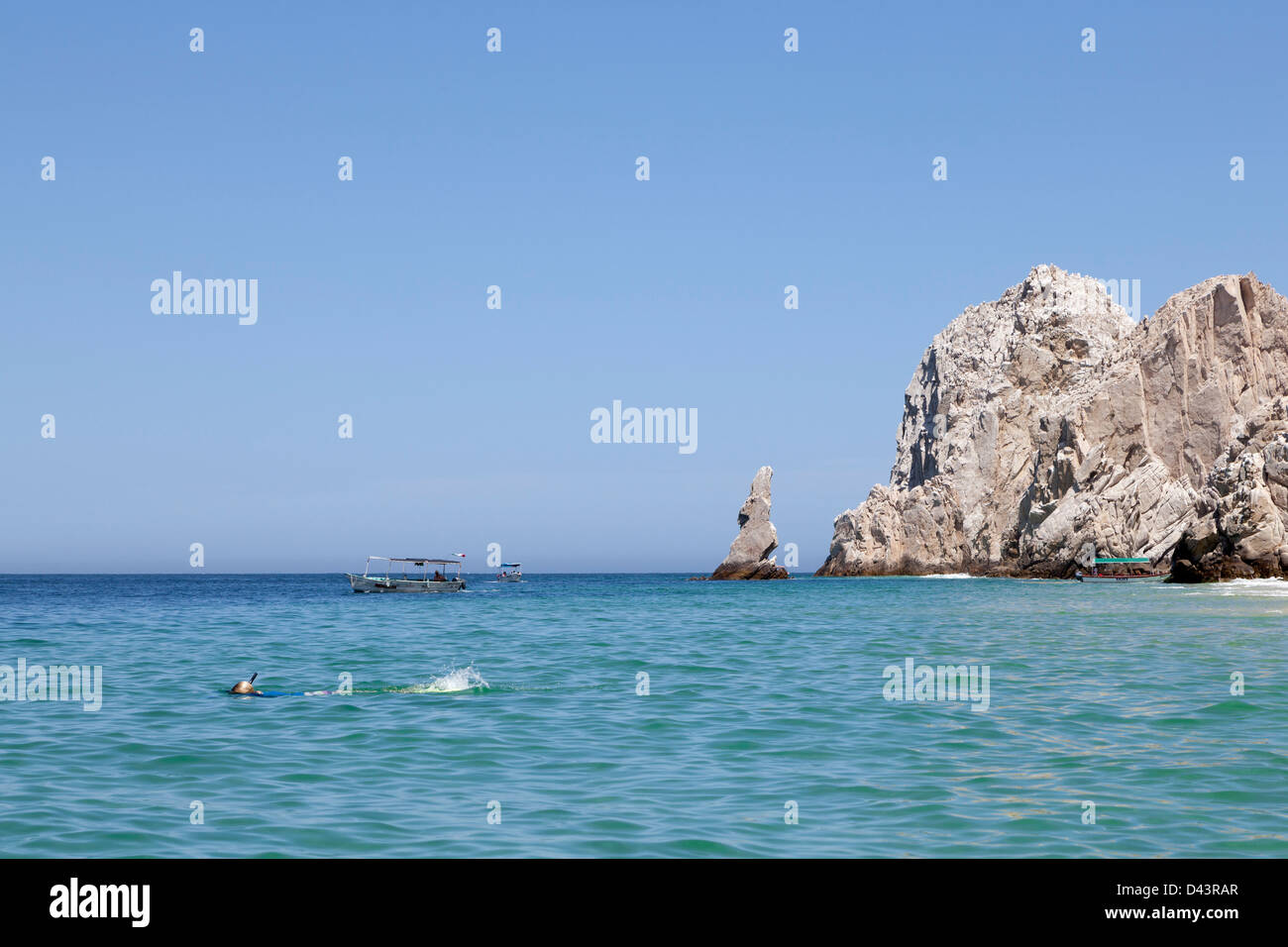 Woman snorkeling next to Lover's Beach in Los Cabos, Mexico Stock Photo Alamy