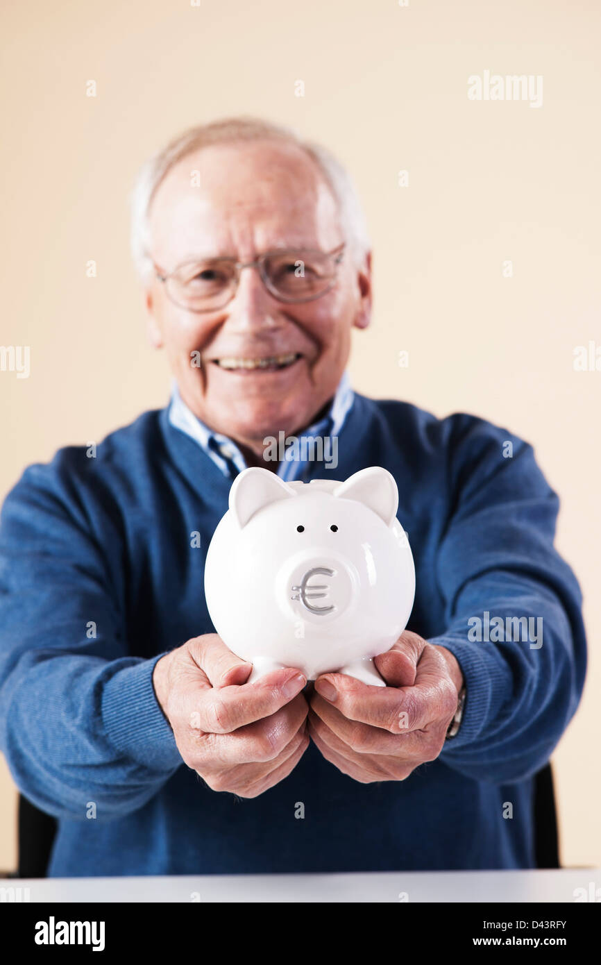 Man male piggy bank money up finance hi-res stock photography and ...