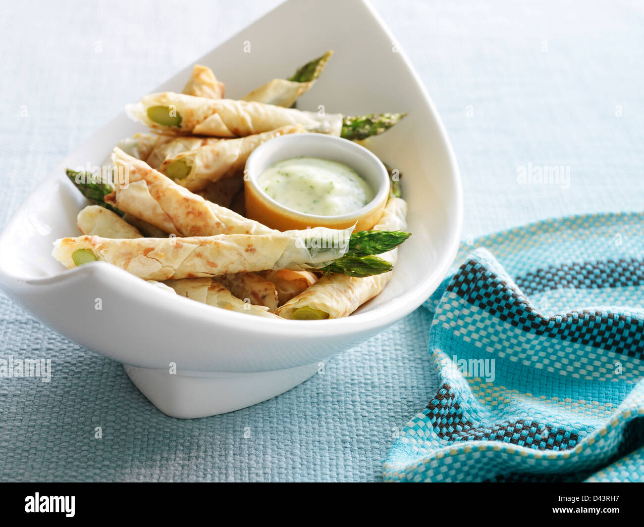 Aparagus Wrapped in Phyllo Pastry with Lemon Herb Sauce Stock Photo