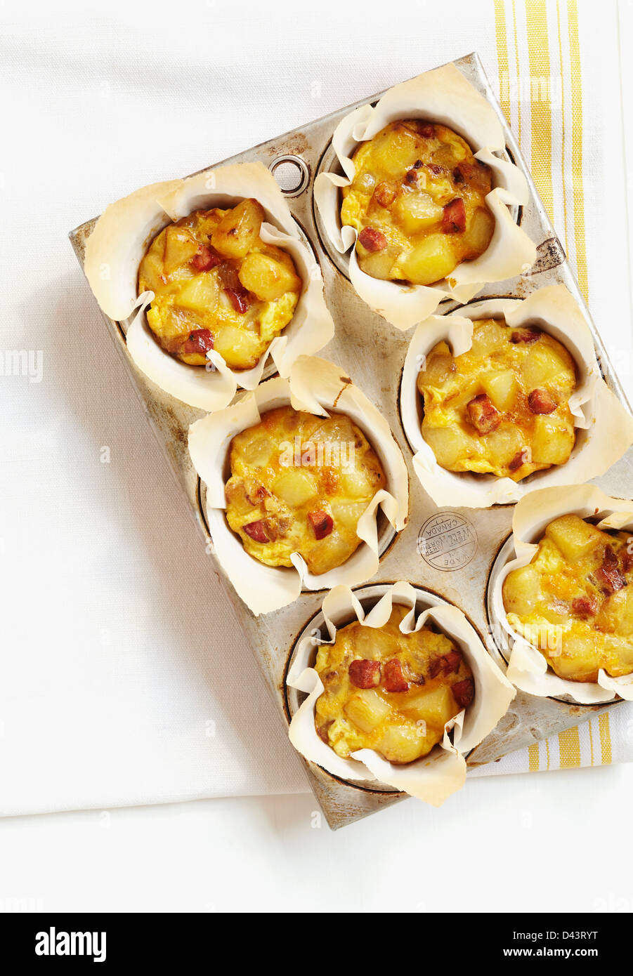 Overhead View of Single Serving Cooked Eggs in Muffin Tin Stock Photo