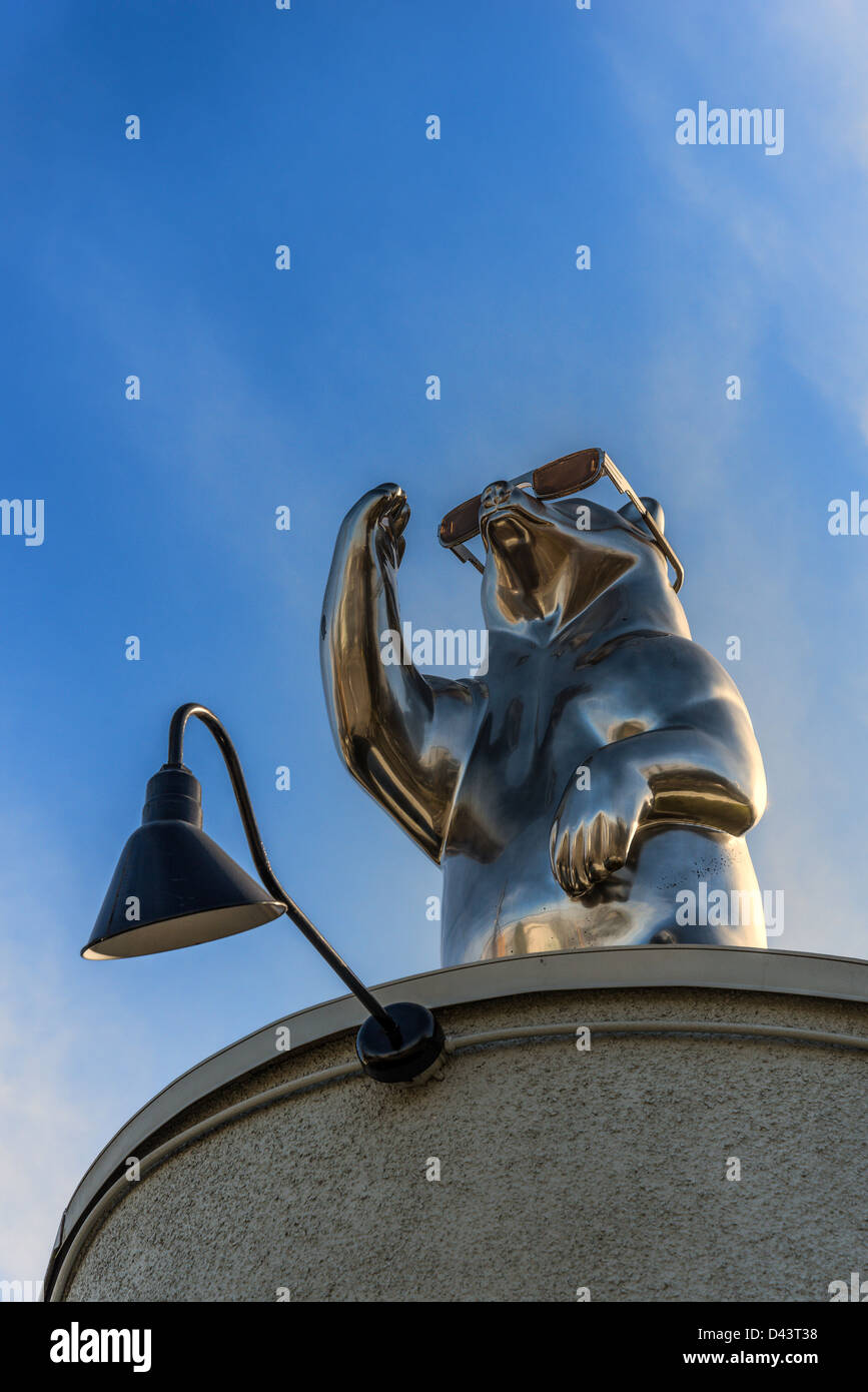 Sculpture on roof. Bear with sunglasses. Stock Photo