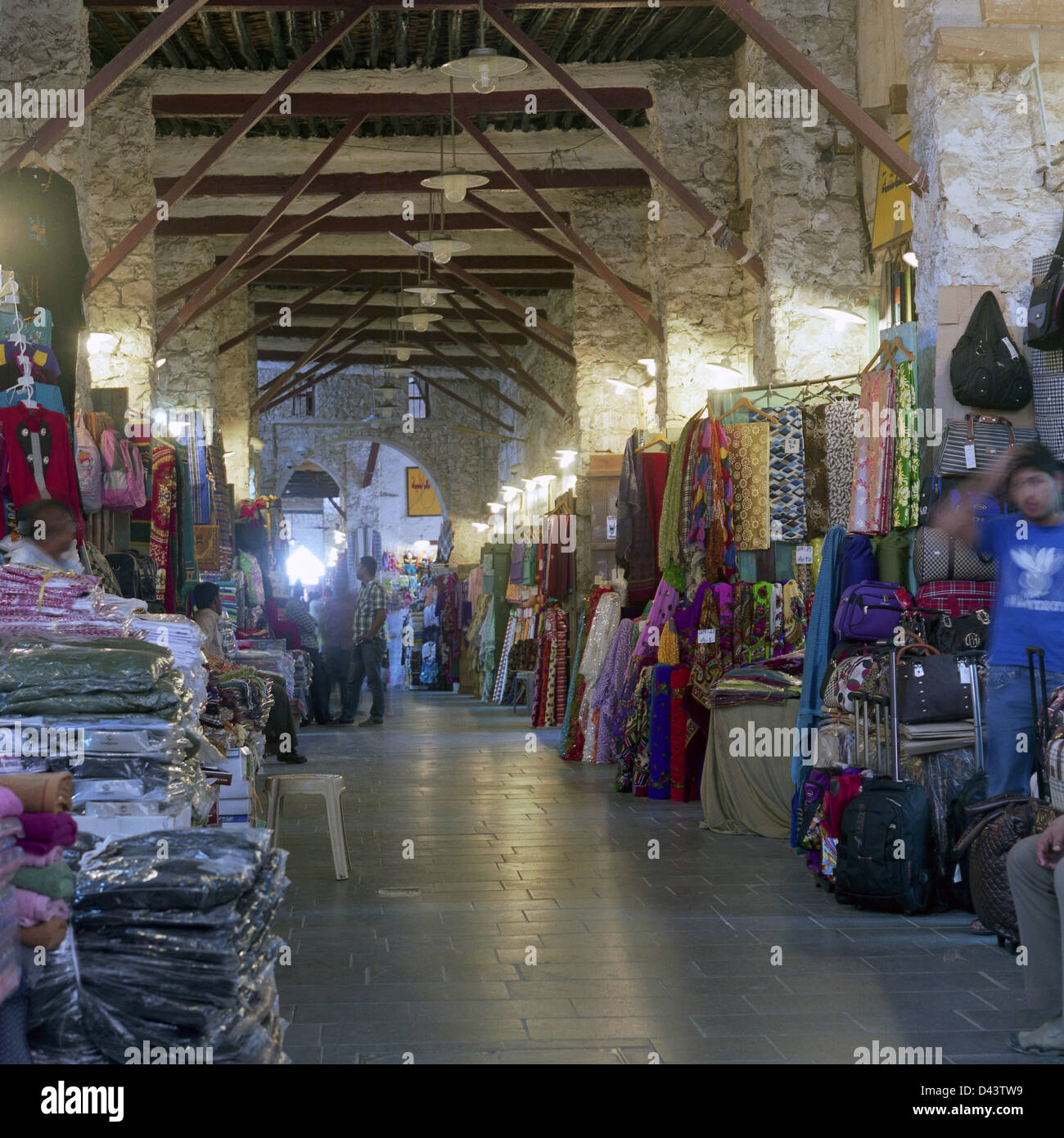 Textile shops in one of the arcades in Qatar's Souq Waqif, a popular