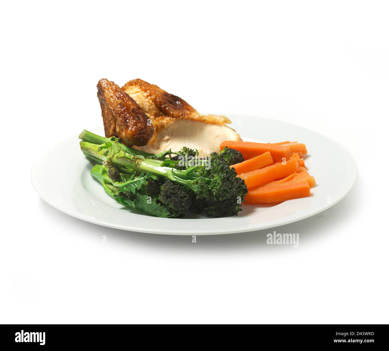 Plate of Chicken with vegetables cut out white background Stock Photo