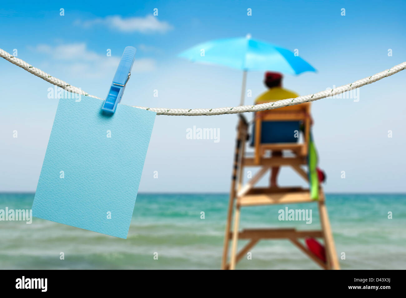 Note papers hooked on a rope. Beach background Stock Photo - Alamy