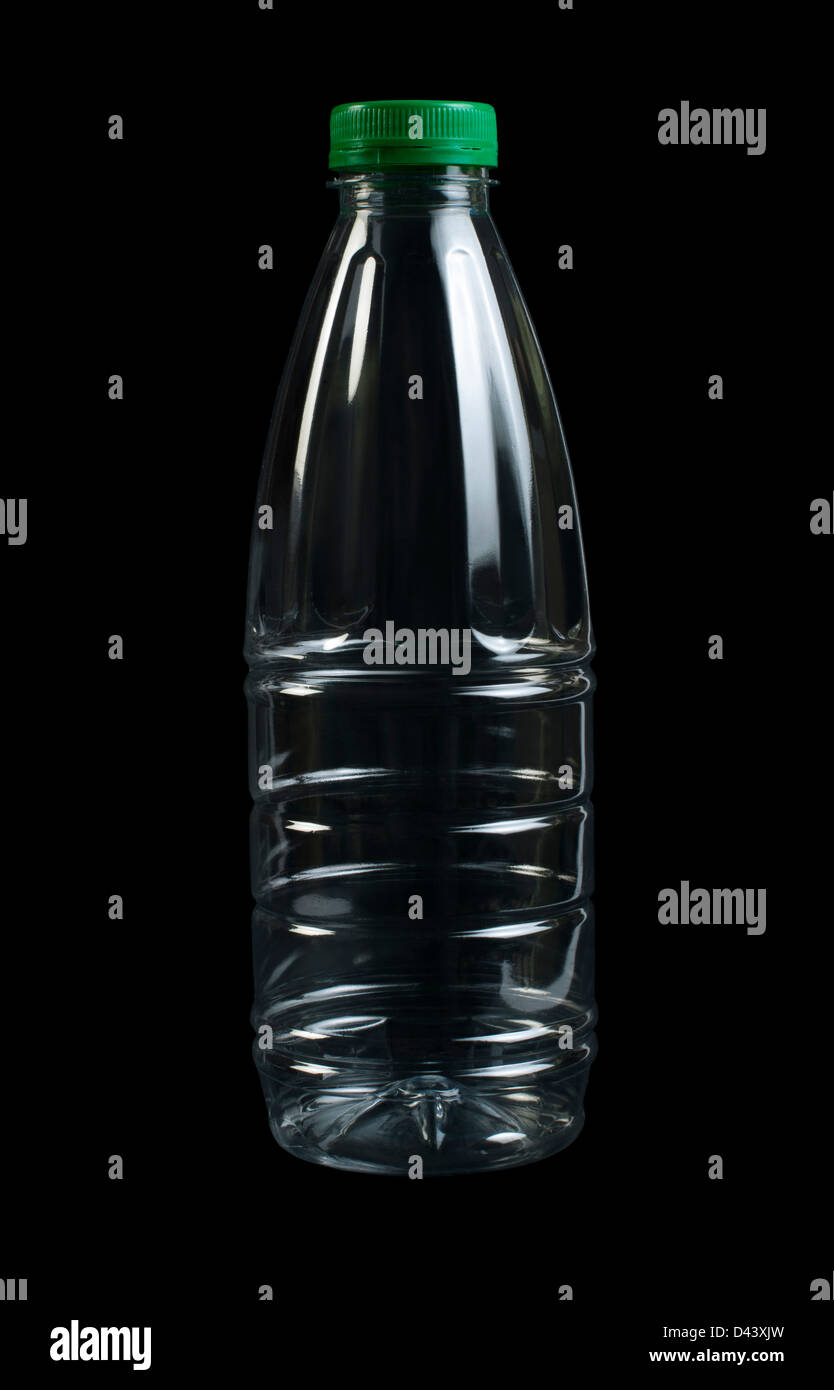 Empty transparent plastic bottle. Black isolated. Green cap Stock Photo