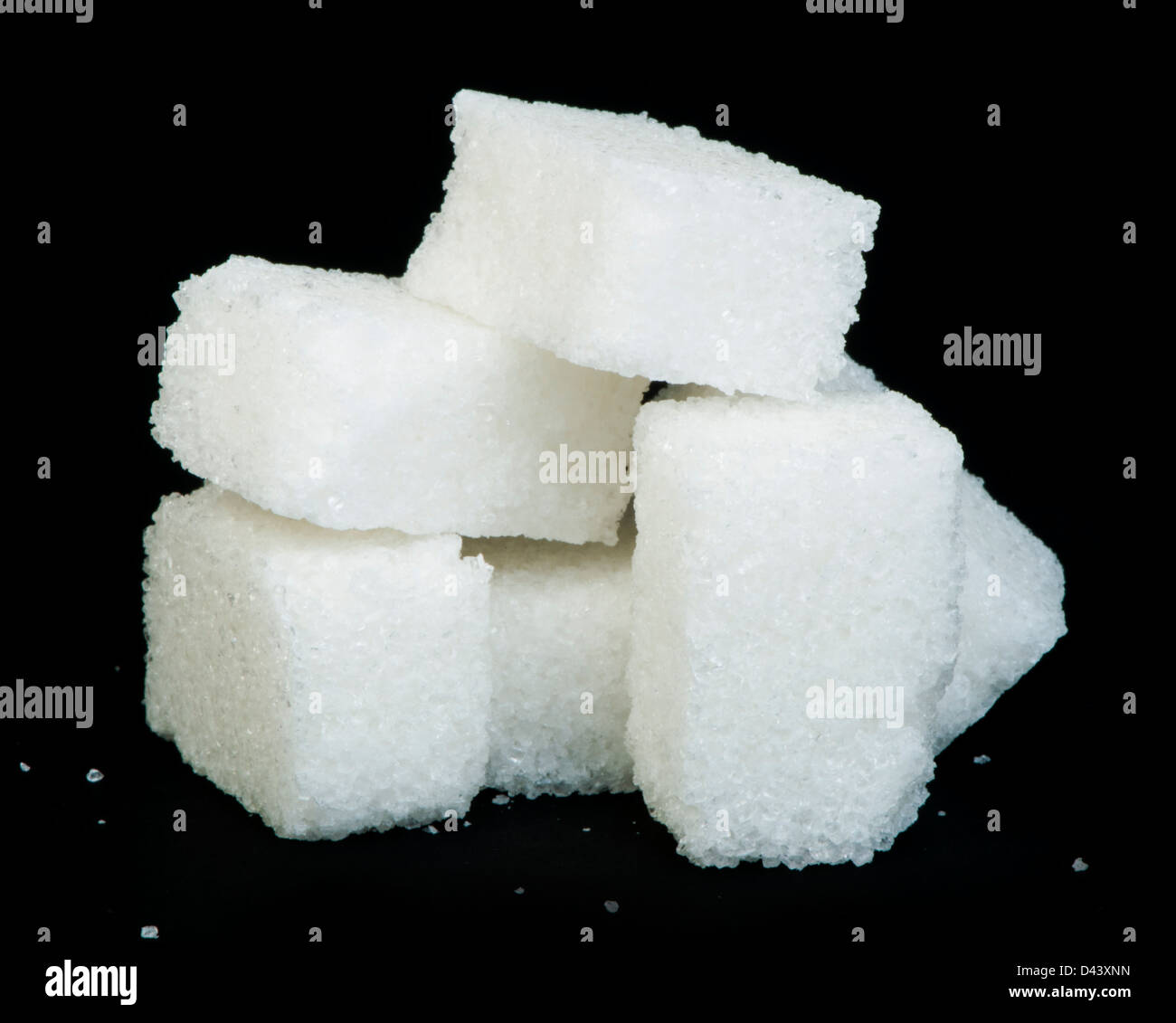 Sugar lumps black isolated. Studio shot Stock Photo - Alamy
