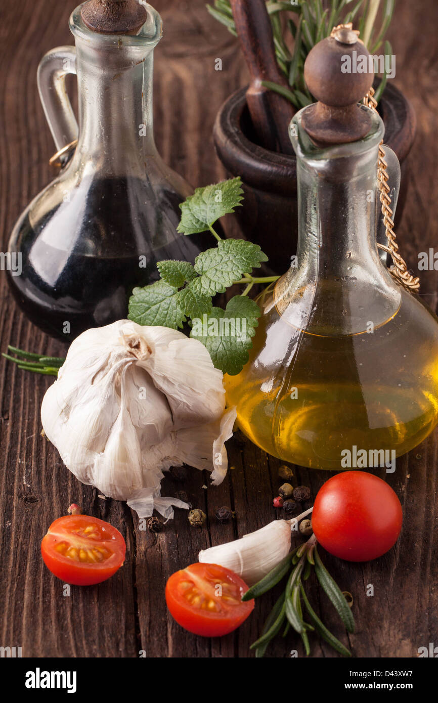 Olive oil, vinegar, garlic and tomatoes Stock Photo Alamy