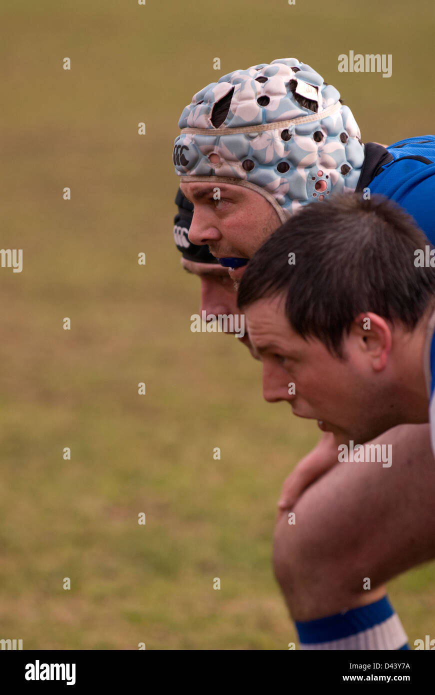 Haslemere rugby players huddle together for a scrum in their match against Merton, Haslemere, Surrey, UK. Stock Photo