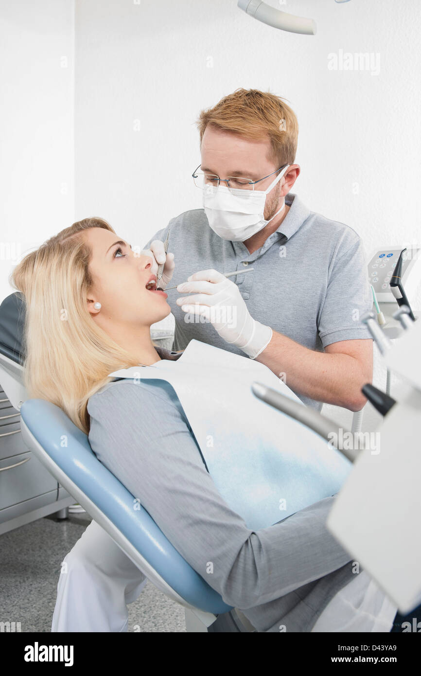 Young Woman and Dentist at Dentist's Office for Appointment, Germany