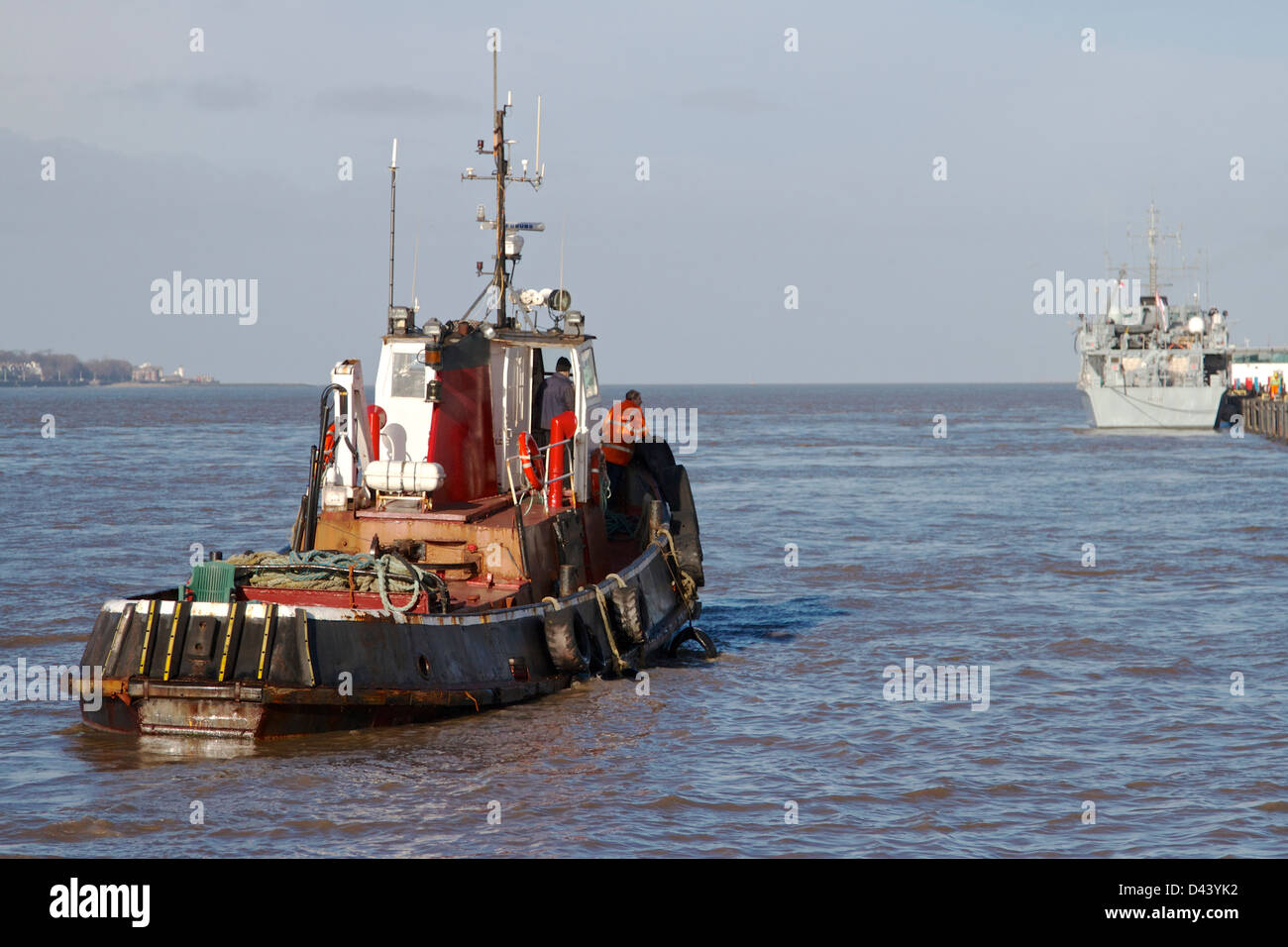 Small motor vessel travelling in river Mersey Stock Photo