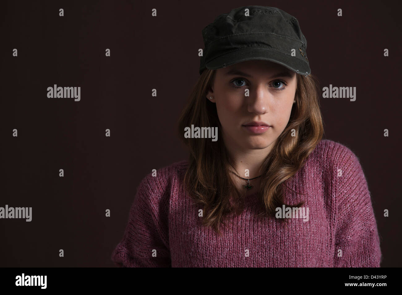 Closeup Portrait of Blond, Teenage Girl wearing Baseball Hat, Studio