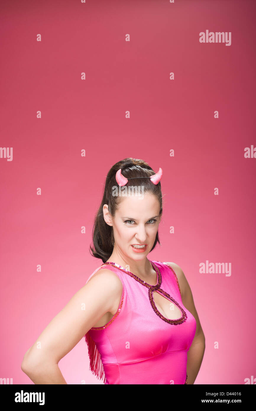Portrait of Woman Wearing Devil Horns and Making Faces Stock Photo Alamy