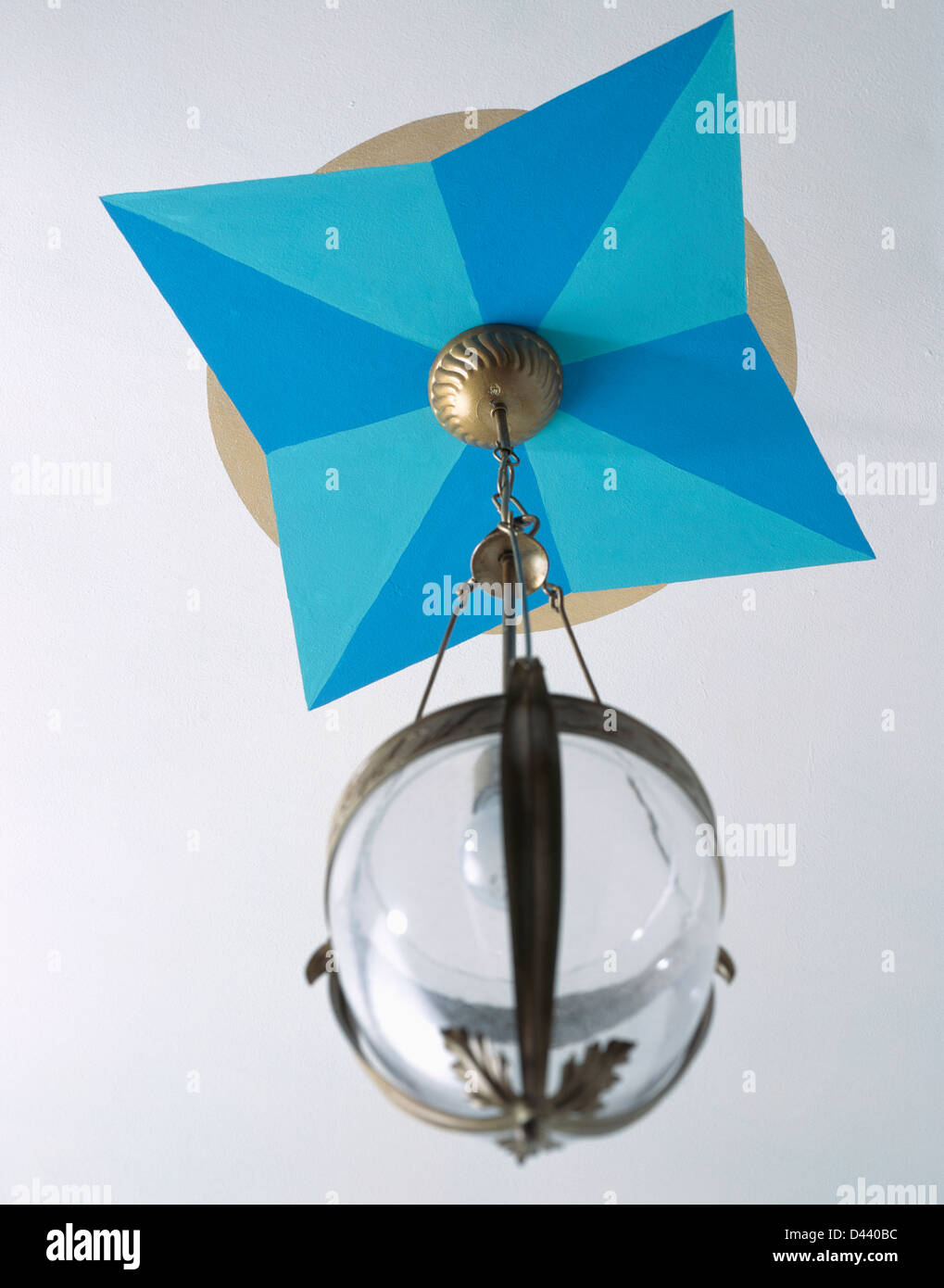 Close Up Of Painted Blue Geometric Patterned Ceiling Rose