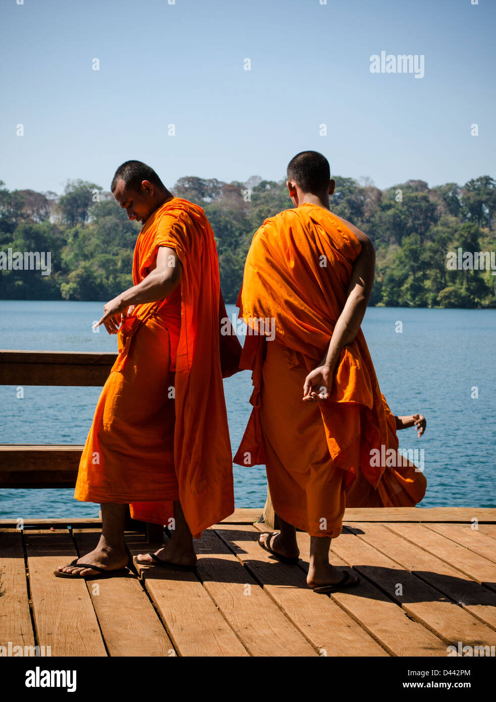 Buddhist monks on holiday at Crater Lake in Ratanakiri Cambodia Stock Photo