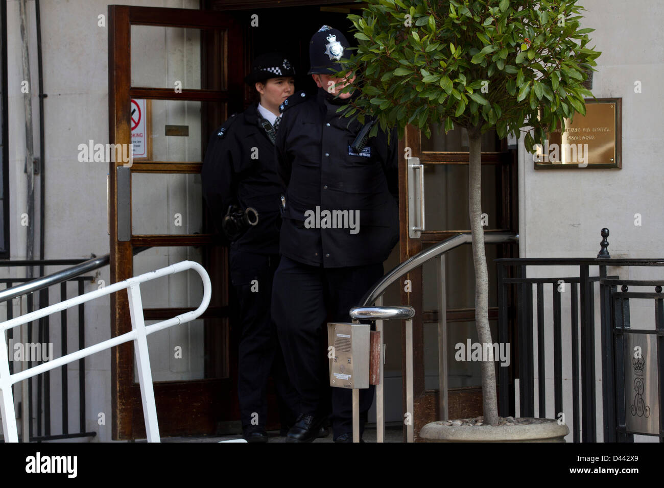 4th March 2013. London UK. Police guard the entrance to King Edward VII hospital in London after Queen Elisabeth II was admitted to hospital for stomach complaints and Gastroenteritis. The Queen spent her first night at the hospital and is expected to stay as a patient for at least 48hours Stock Photo