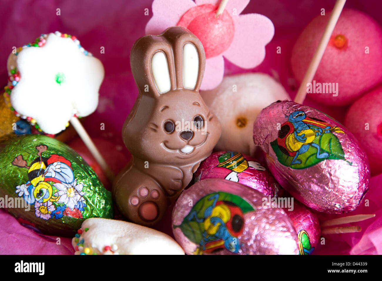 Easter bunny and eggs in a pink sweet background. Stock Photo