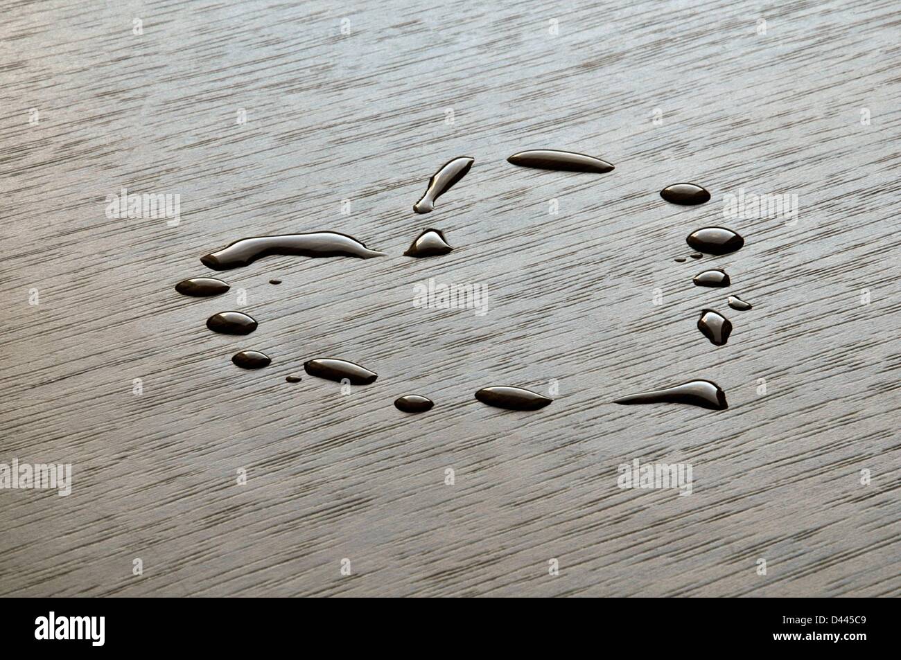 A heart formed by water drops is pictured on a table top in Berlin, Germany, 13 October 2011. Fotoarchiv für Zeitgeschichte/S.Steinach Stock Photo