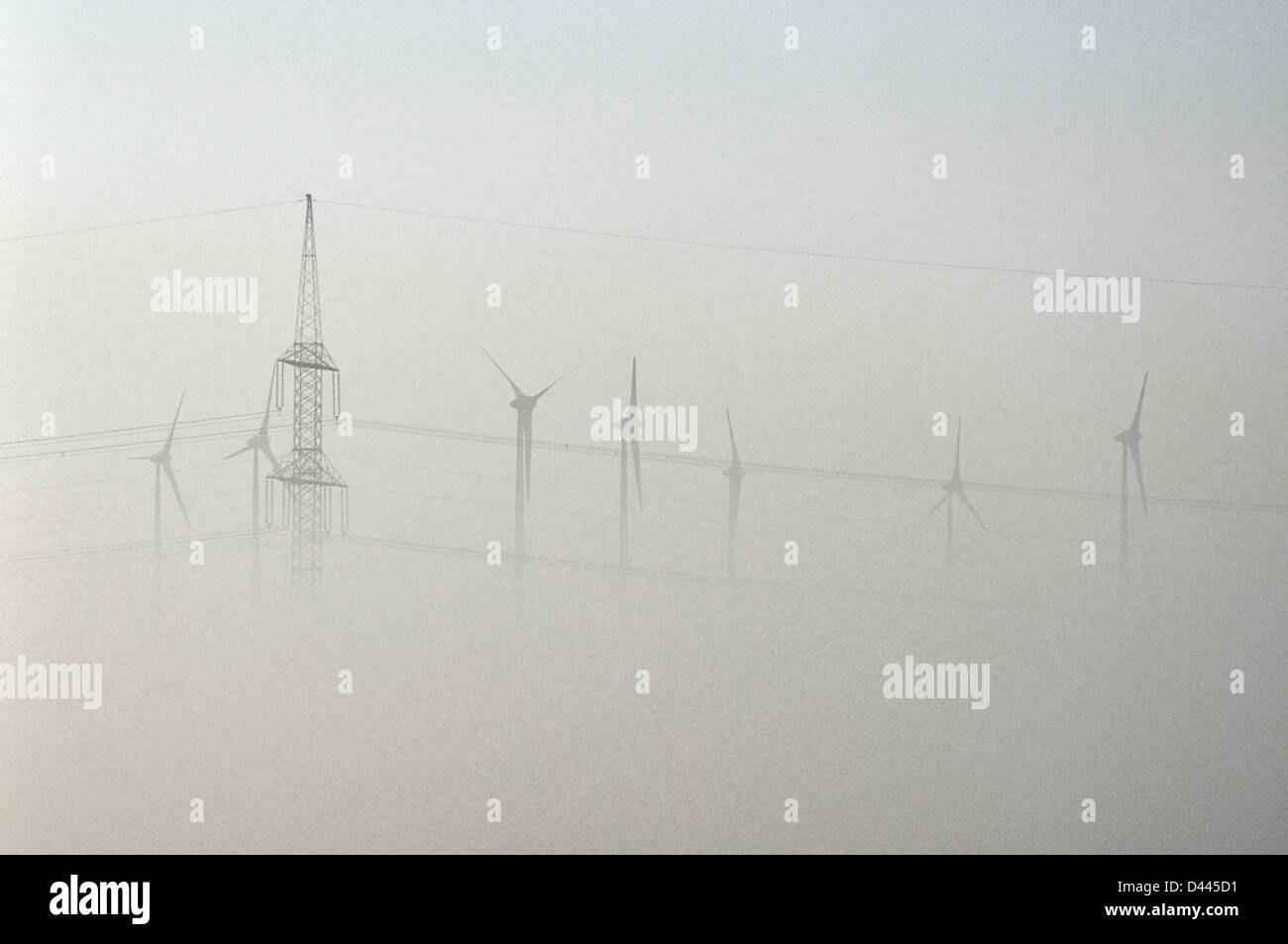 Windmills and power poles almost disappear in the autumn fog in Prignitz, Germany, 1 October 2011. Fotoarchiv für ZeitgeschichteS.Steinach Stock Photo