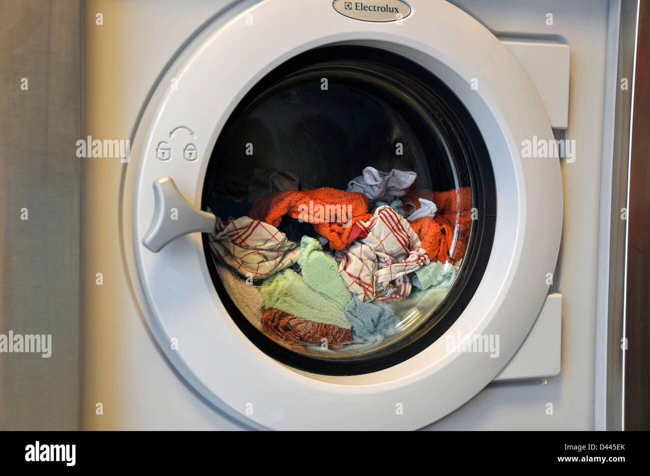 View of a washing machine filled with clothes in Berlin, Germany, 18 September 2011. Photo: Berliner Verlag/S.Steinach Stock Photo