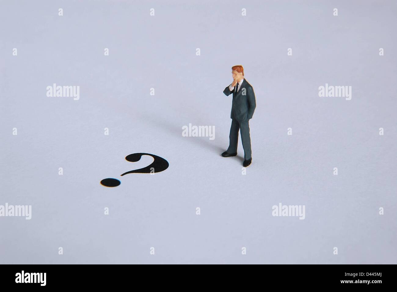 Illustration - A miniature figure in a suit stands in front of a question mark in Berlin, Germany, 5 December 2007. Fotoarchiv für ZeitgeschichteS.Steinach Stock Photo