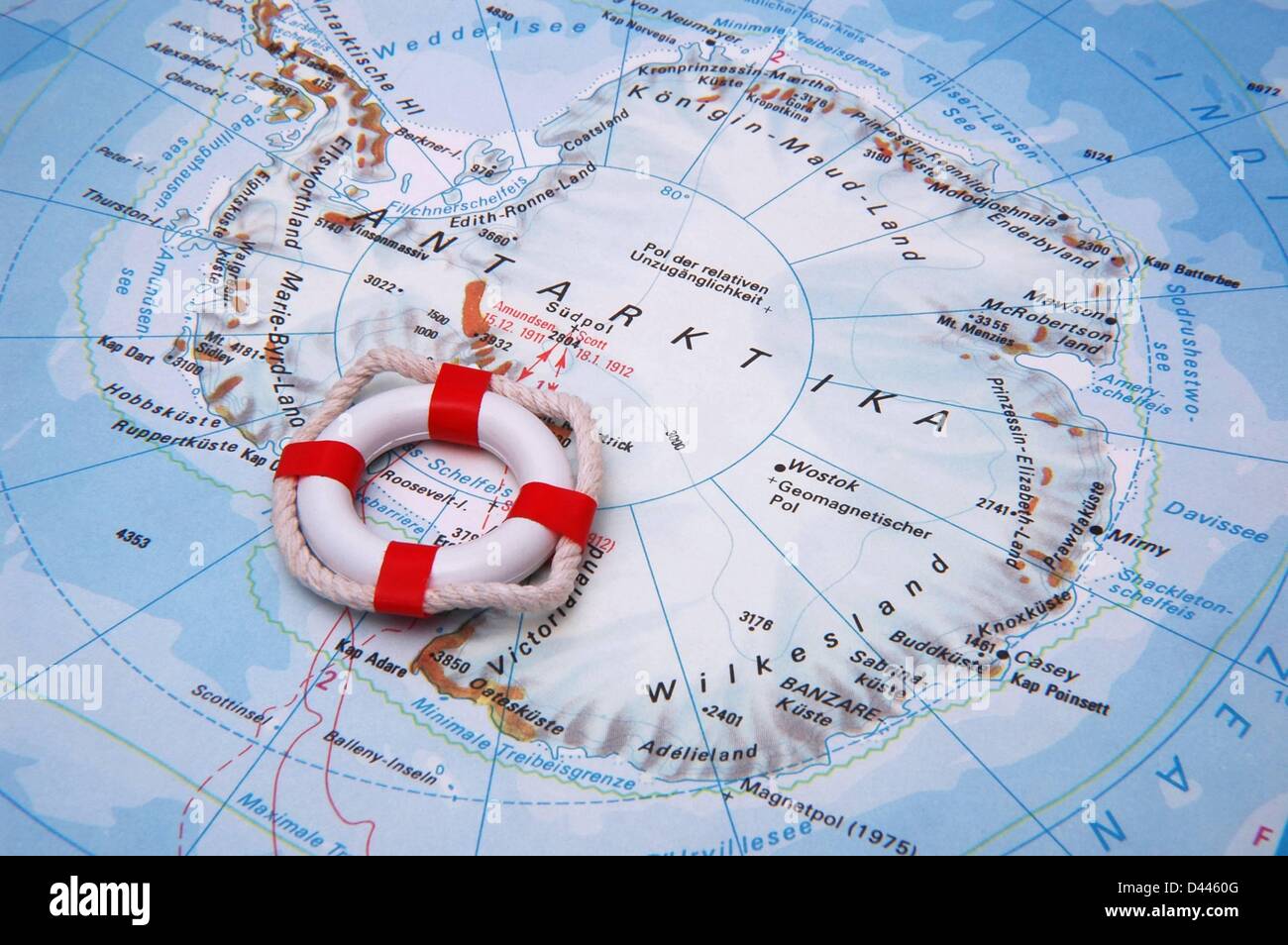 Illustration - A miniature safety buoy is pictured lieing on the south pole of a world map in Berlin, Germany, 22 December 2007. Photo: Berliner Verlag/S.Steinach Stock Photo
